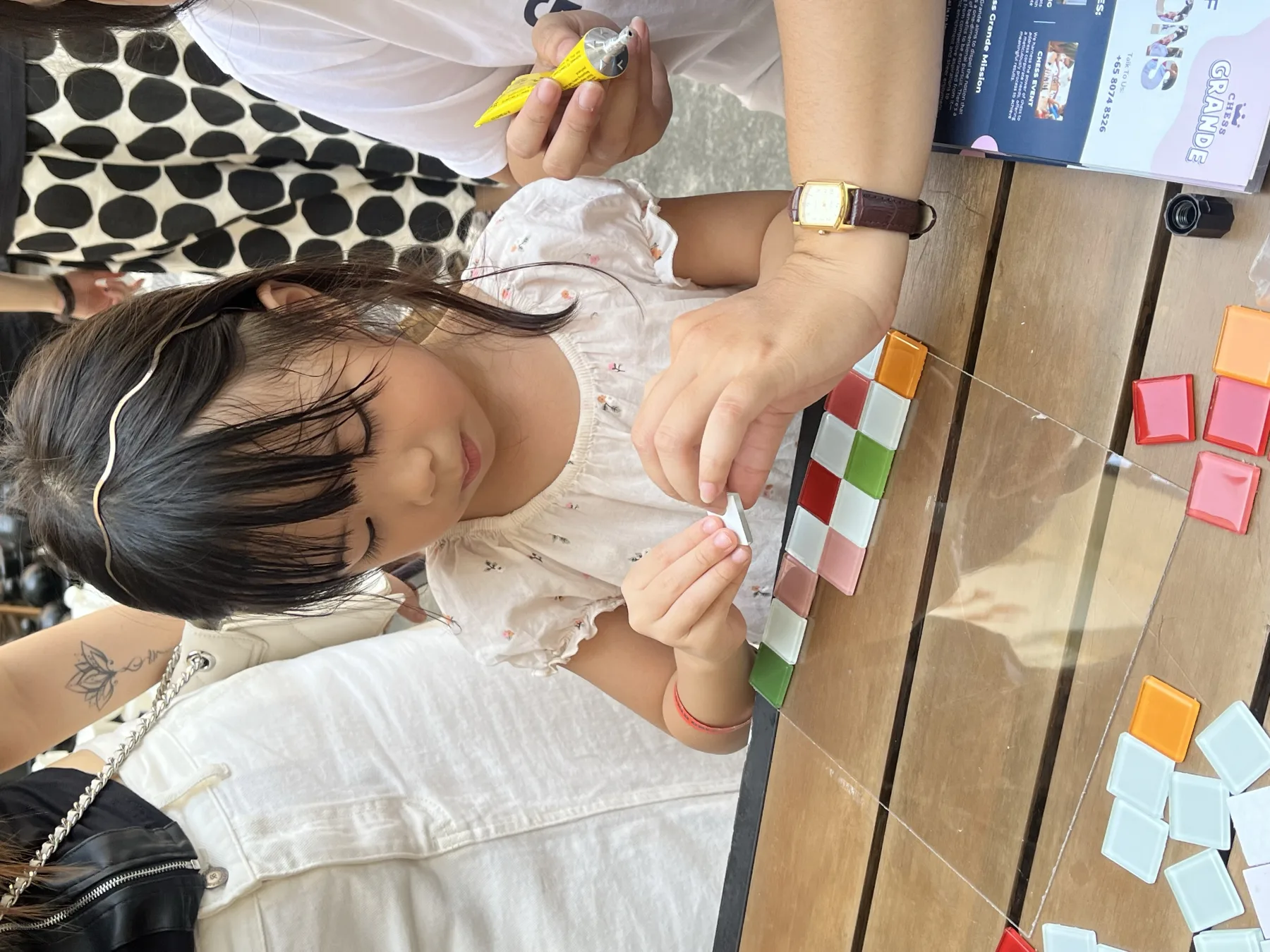 A child making a colourful chess set during an arts-and-crafts activity