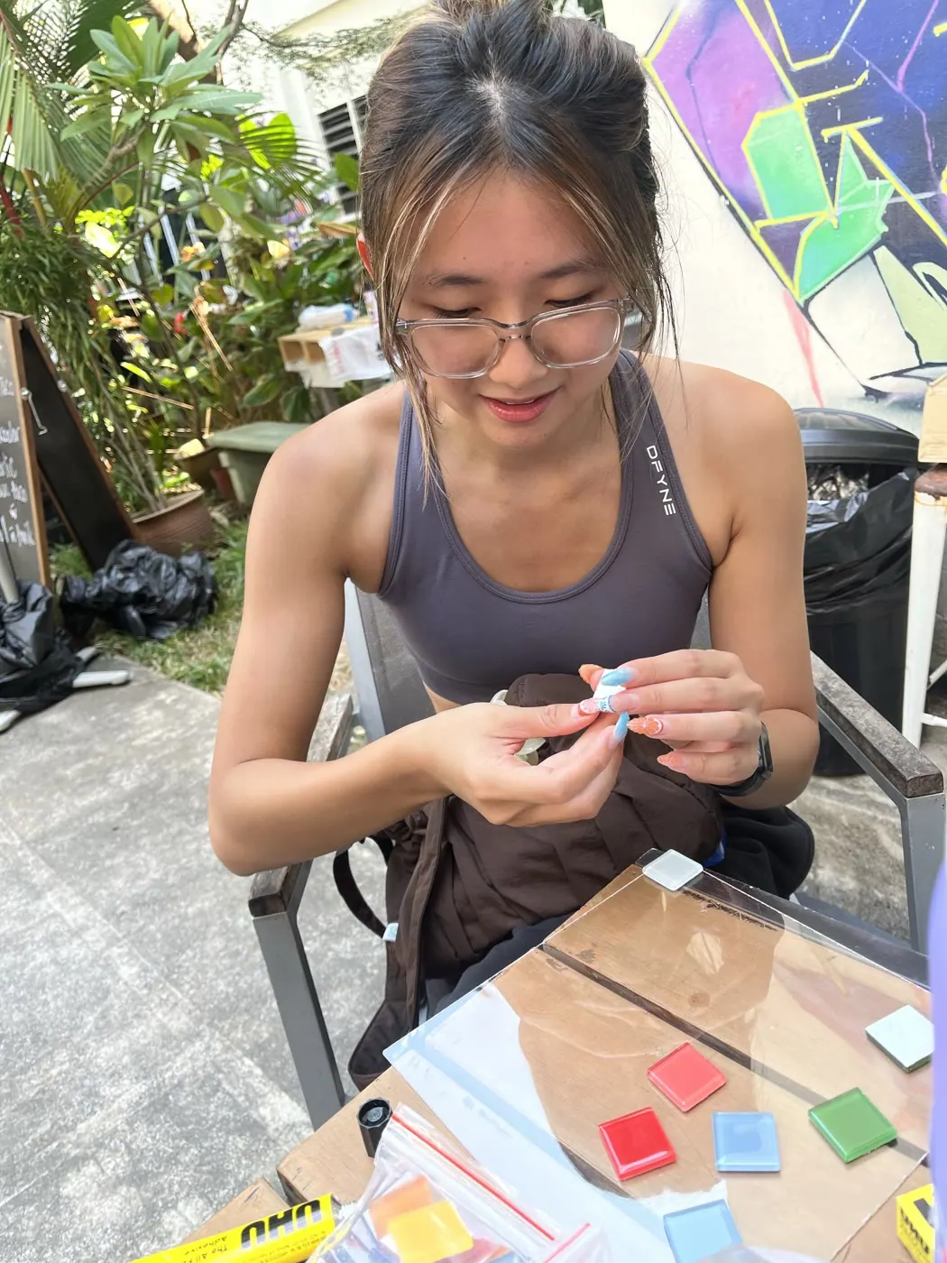 An attendee creating pieces for a build-your-own chess set