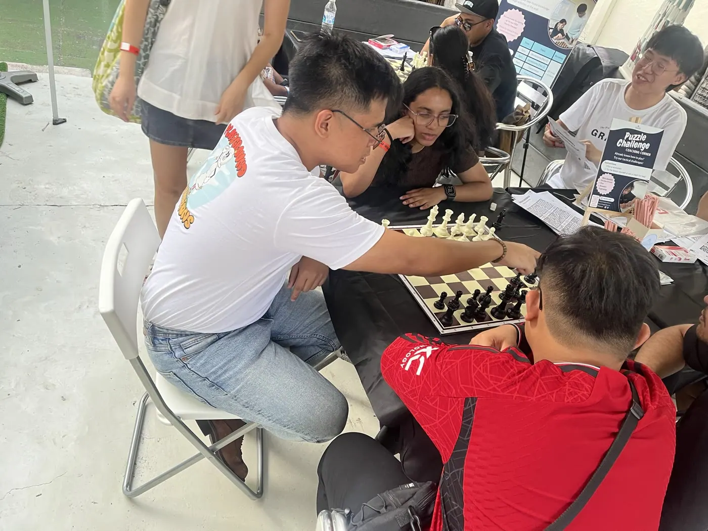 Visitors playing a friendly game during Aliwal World Chess Day