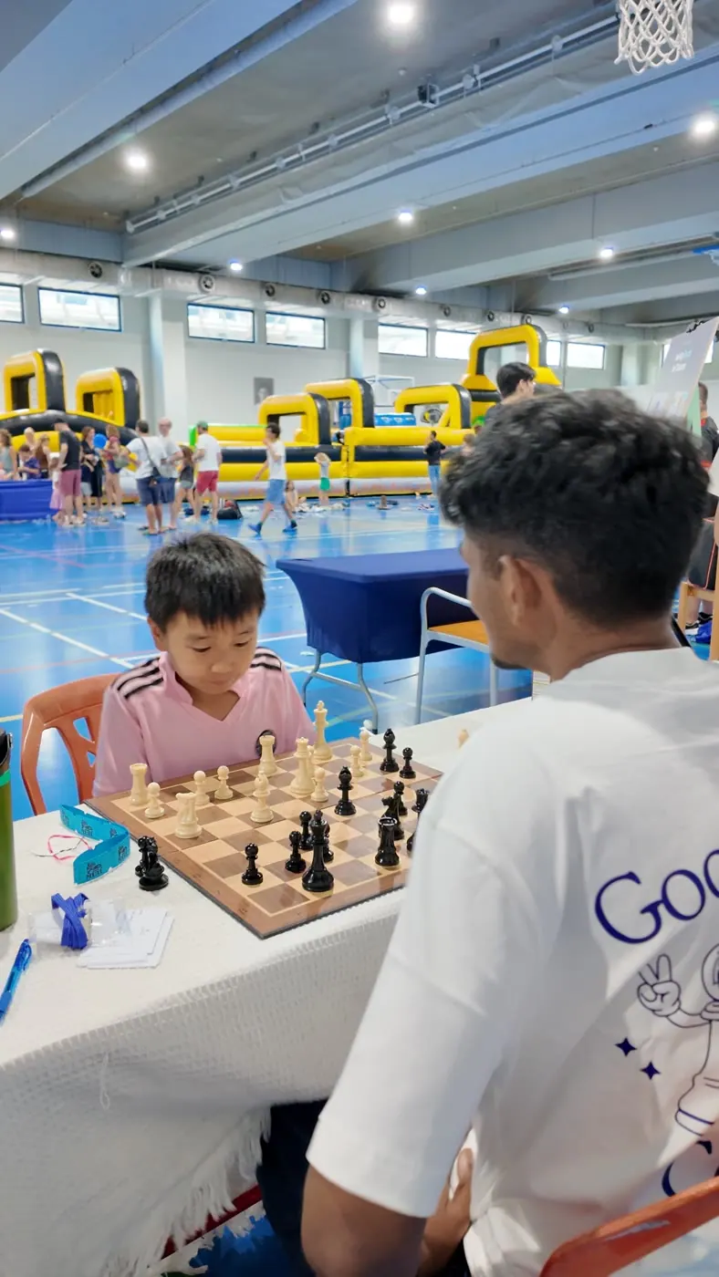 Chess Grande coaches guiding games during Fête de l’École