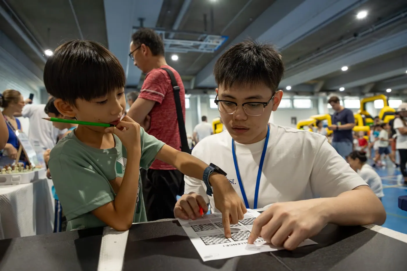 A visitor working through a Chess Grande puzzle challenge