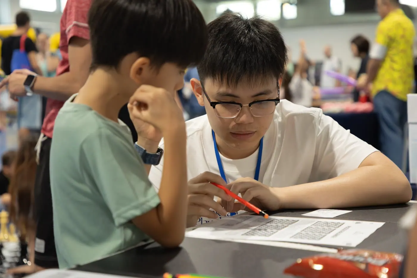 Children waiting to join activities at the Chess Grande booth
