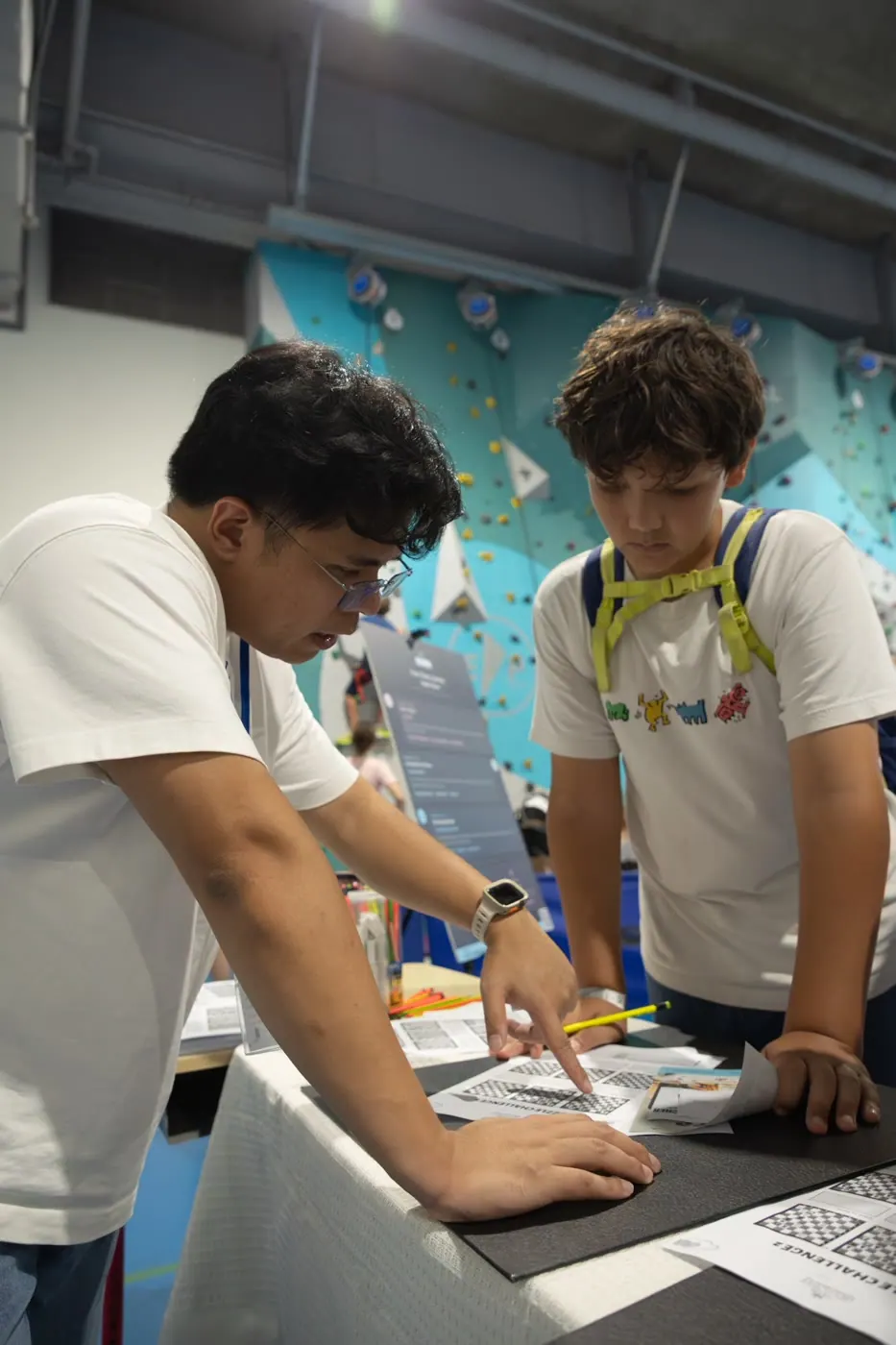 A busy crowd participating at the Chess Grande Fête de l’École booth