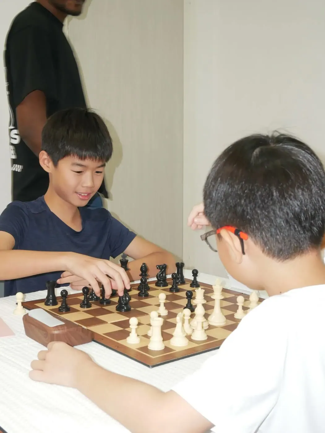 Season 2 players facing each other across a chessboard