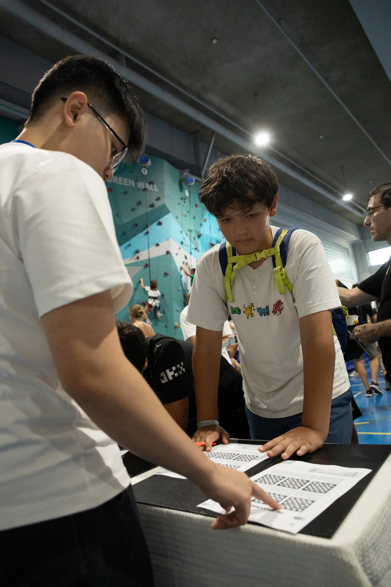 A visitor completing a Chess Grande chess worksheet