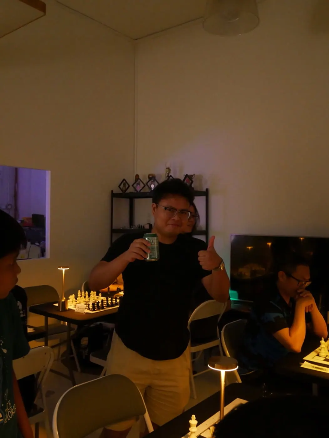 A Checkmate and Chill participant giving a thumbs-up between games